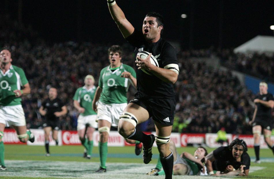 2006. All Blacks lock Troy Flavell celebrates as he heads in for a try at Waikato Stadium. The...