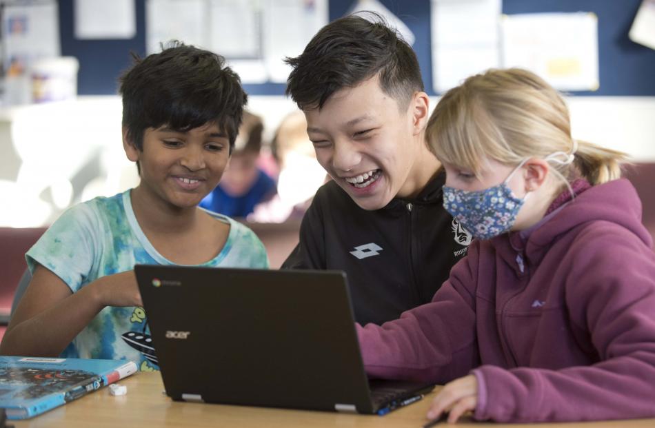 Laxshay Praveen (left, 10), Genjin Gurung (10) and Zara Owen (9) enjoy quizzing.