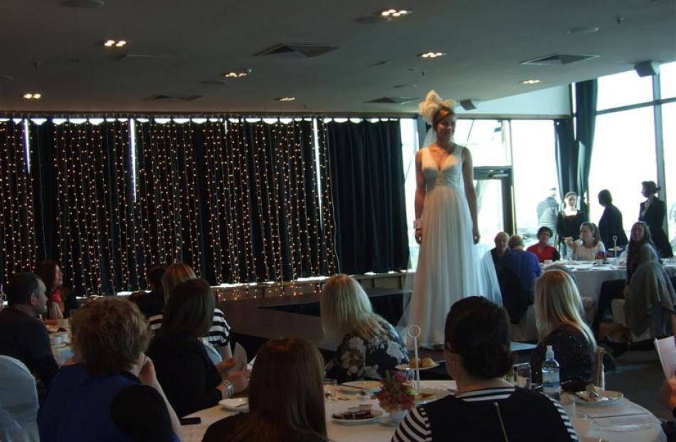 Model Lisa Petrowski models bridal wear during the high tea and fashion show.