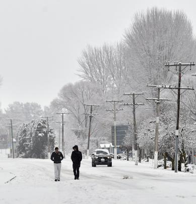 Locals take their daily stroll through Omarama yesterday. PHOTO: PETER MCINTOSH