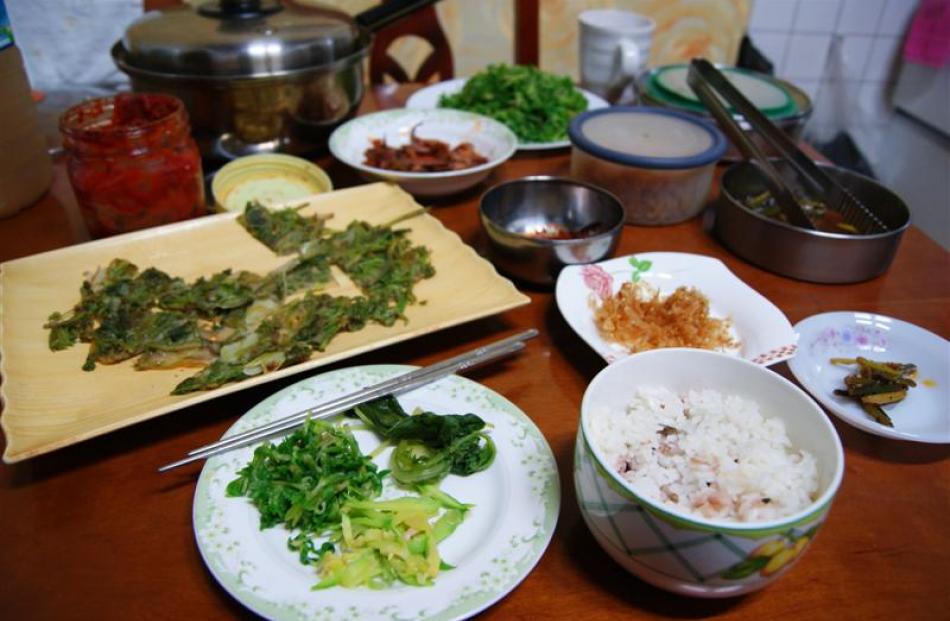 A typical meal at my homestay - clockwise from bottom right: rice, small plate with helpings of...