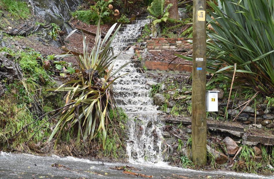 Water cascades down steps at Buccleugh St on Tuesday. PHOTO: GREGOR RICHARDSON