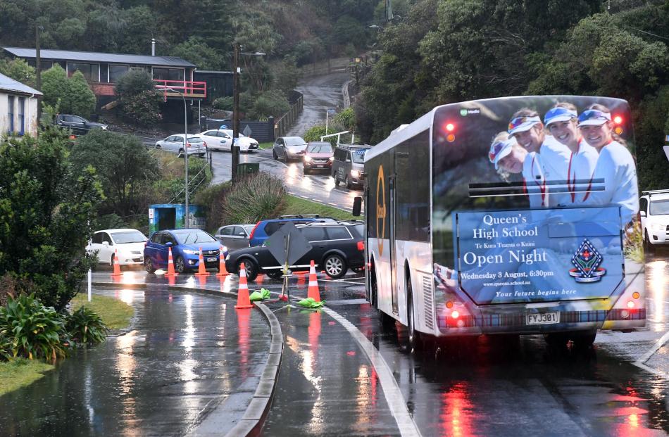 With Portobello Rd closed at Marne St, vehicles converge at the Larnach Rd detour on Tuesday...