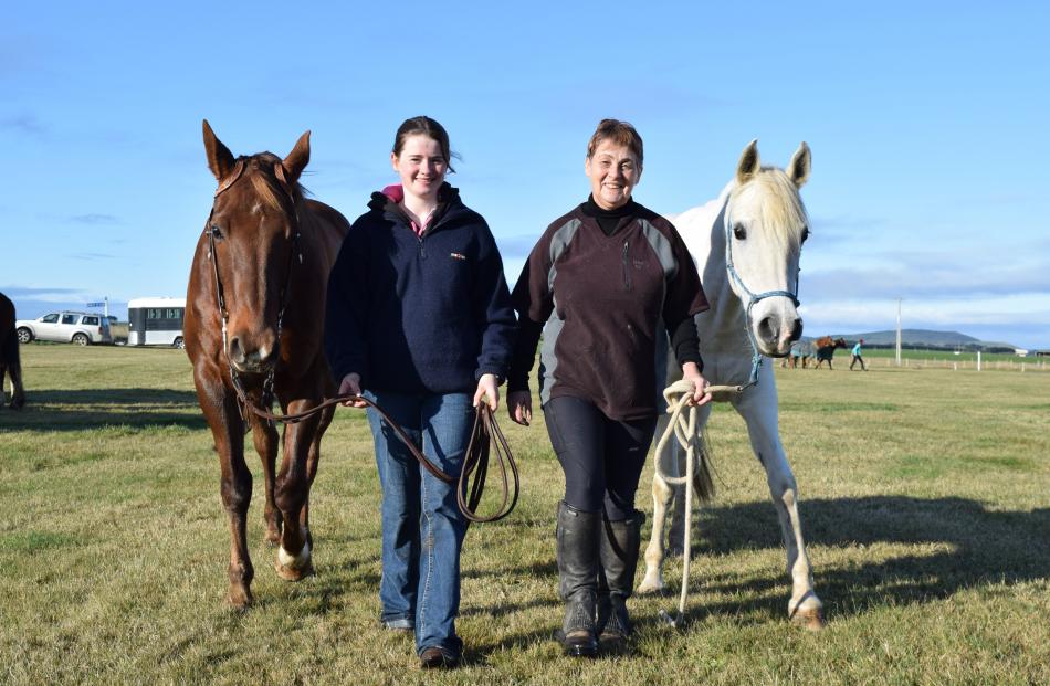 Amilea Sparrow (15) leads horse Kash, and Maree Macdonald leads horse Minty, both of Invercargill...