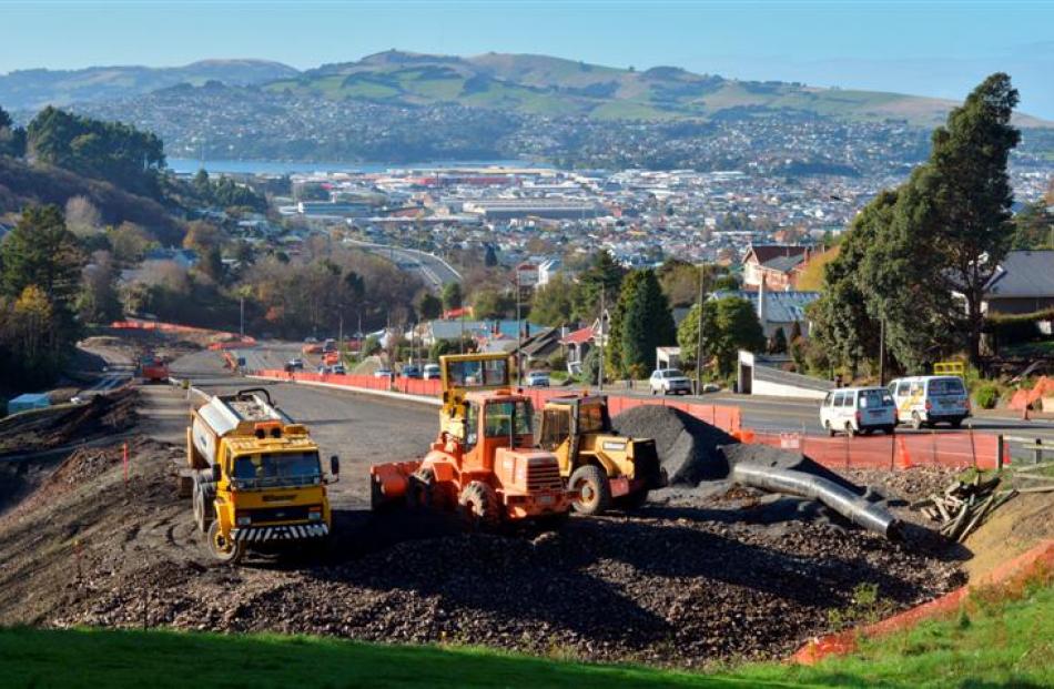 Construction of the Caversham Highway continues yesterday, on top of a pre-1900 water reservoir...