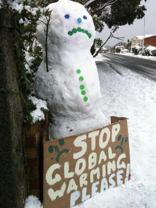 Even snowmen are worried about climate change. Photo by Andrew Leitch in Roslyn at noon.