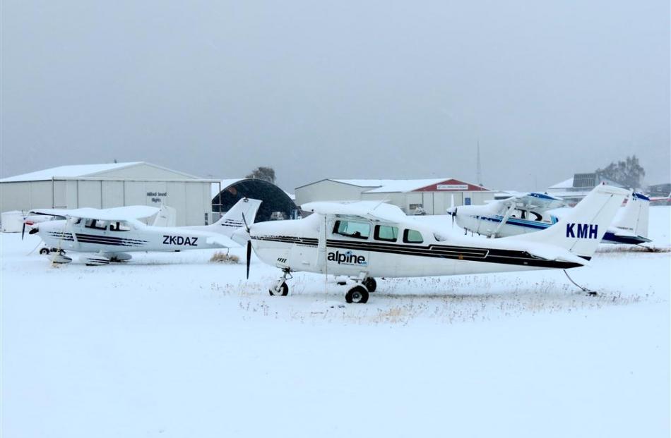 Sight-seeing and private planes covered in snow in Queenstown. Photo by James Beech