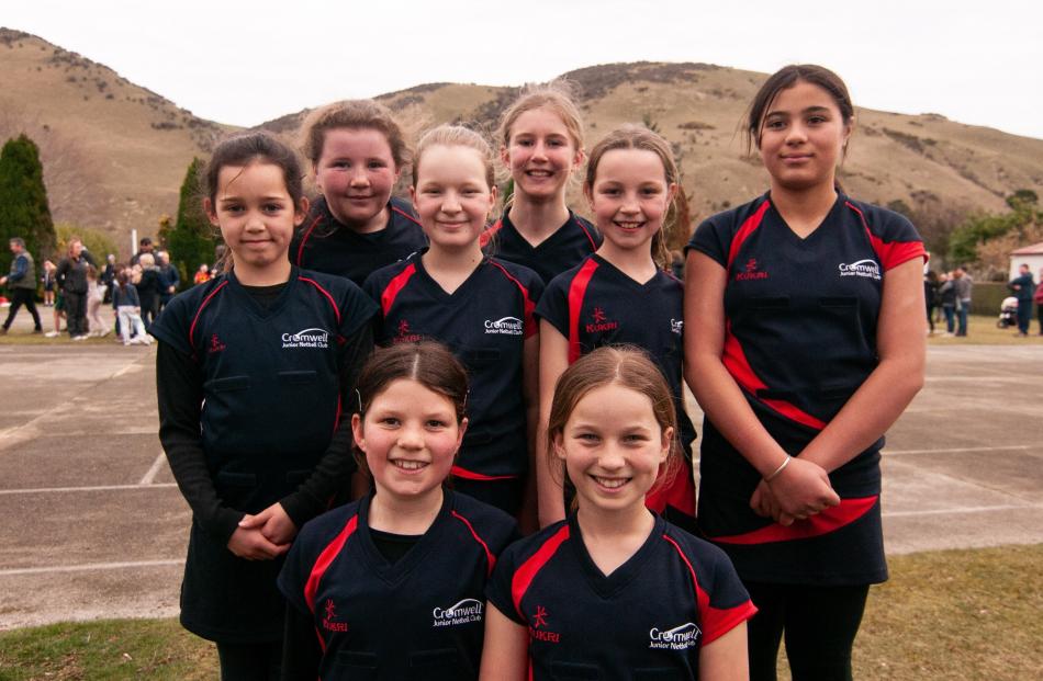Cromwell Red netball team (back left) Sophia Kimpton (10), and Eva Settle (10), (middle from left...