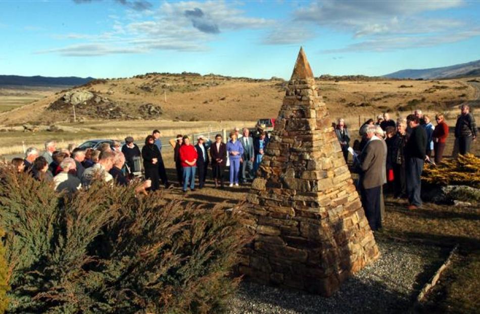 People gather at the memorial cairn on the occasion of the 60th anniversary. Photos from the ODT...