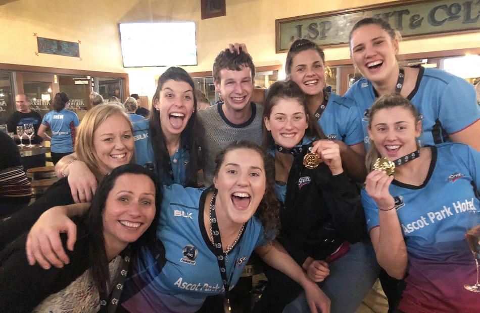 Otago Daily Times sports reporter, Jeff Cheshire, with members of the victorious Southern Steel...