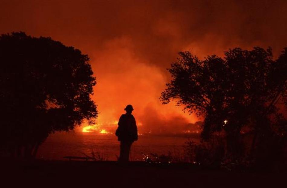 Firefighters battle wildfires in California this week.