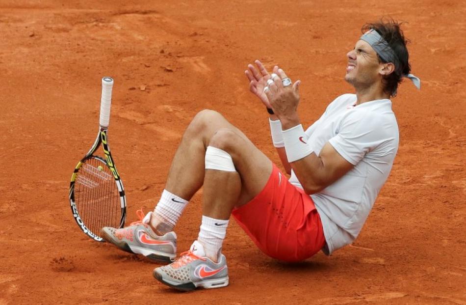 Rafael Nadal celebrates defeating to claim his eighth French Open title. REUTERS/Philippe Wojazer