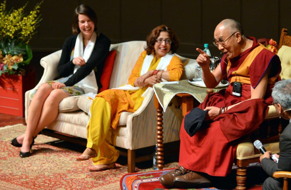 Dunedin City Councillor Jinty McTavish and former Mayor Sukhi Turner listen to the Dalai Lama.