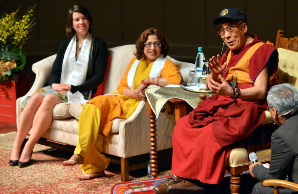 Dunedin City Councillor Jinty McTavish and former Mayor Sukhi Turner listen to the Dalai Lama.
