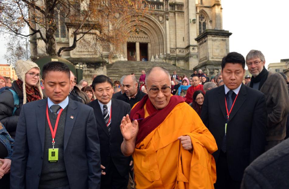 The Dalai Lama leaves the gathering of church representatives.