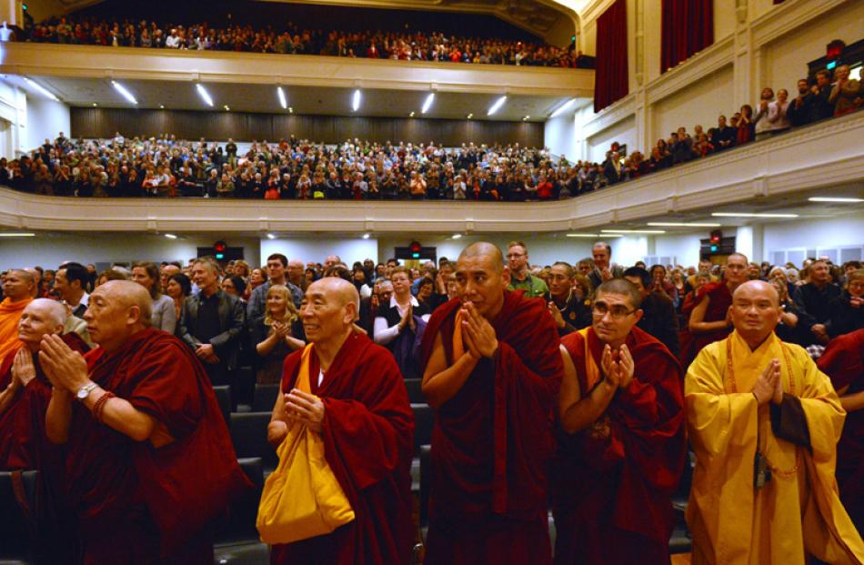 The Dalai Lama receives a standing ovation after his speech.
