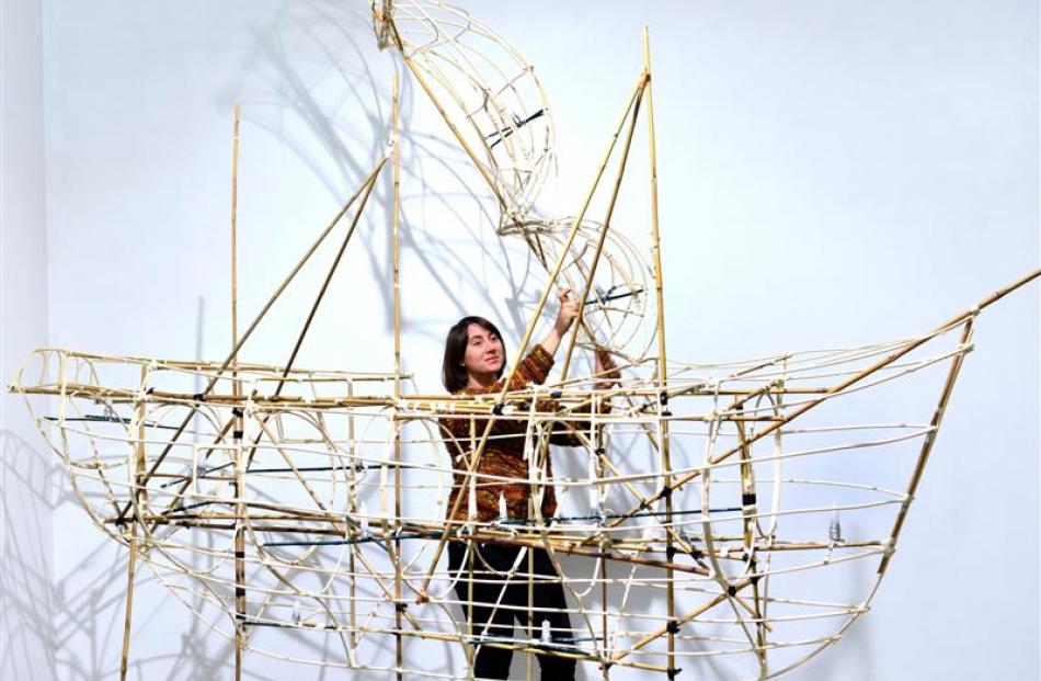 Katrina Thomson builds the sailing ship lantern.