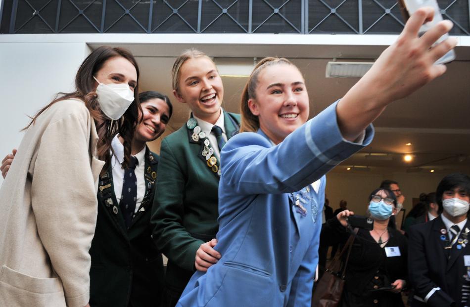 Prime Minister Jacinda Ardern poses for a selfie with (from left) Columba College pupils Lily...