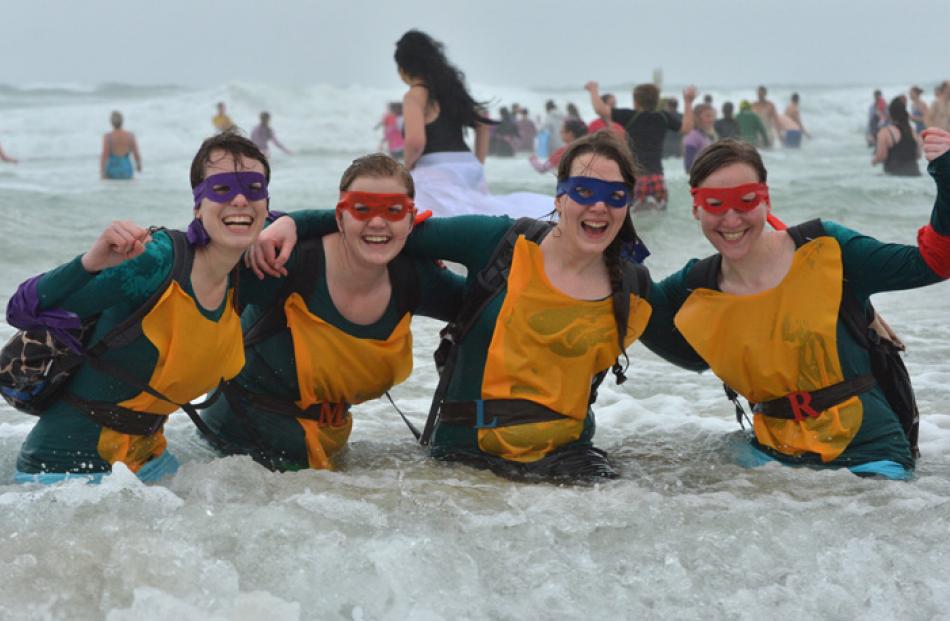 Dressed as Teenage Mutant Ninja Turtles yesterday  were (from left) Claire Black (23), of Dunedin...
