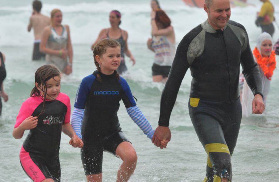 Coming in from the Polar Plunge  yesterday are (from right) Conrad Anderson, Ruby Anderson (8)...