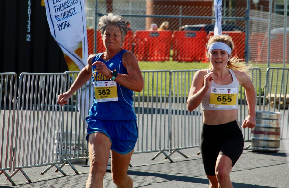 Karin Drummond (left) and Jess Moffett find a burst of strength as they reach the finish line of...