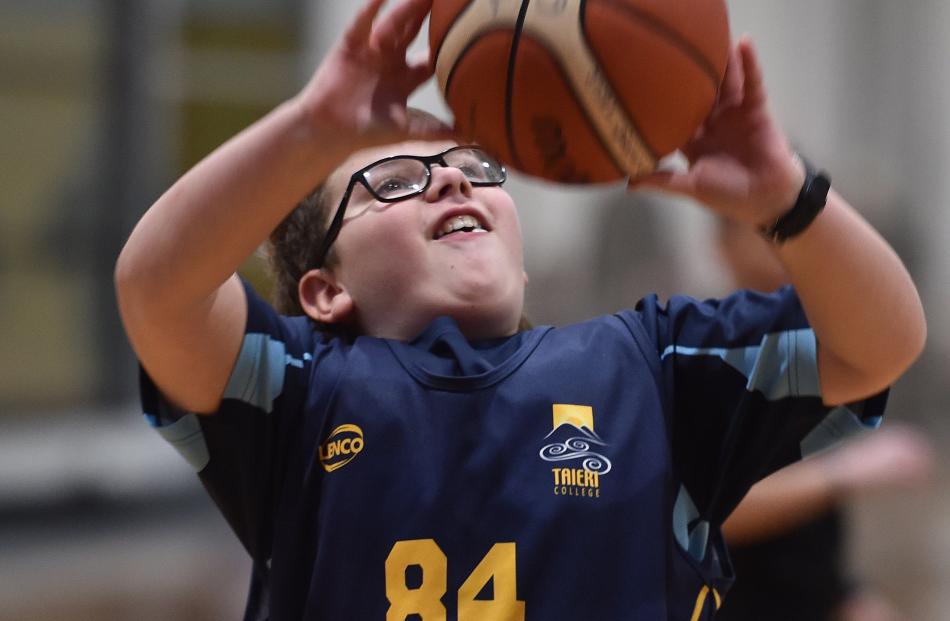 Lucas Tikey (12), from Taieri College, shoots during a game against Tahuna.