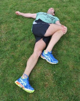 Hip rotator stretch: While on the ground, take your leg across your other leg, and while holding...