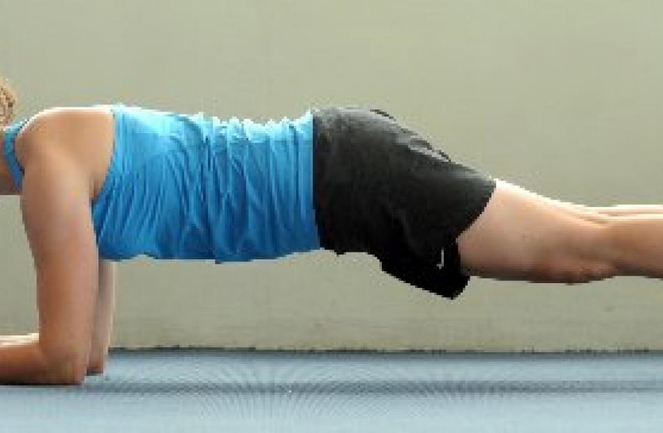 Prone abdominal hold: Hold yourself on your forearms and feet while maintaining a nice straight...