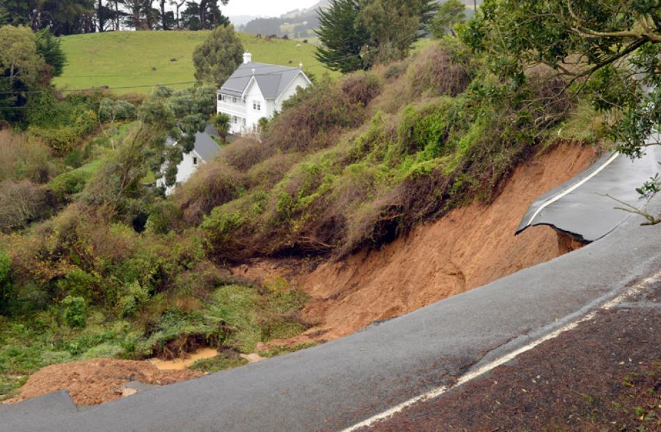 A slip in Blanket Bay, Dunedin, brought down this hillside damaging a house and car.