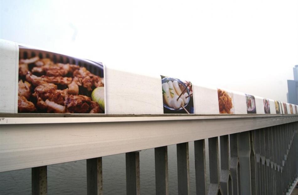 Pictures of food to distract the passersby from their thoughts.
