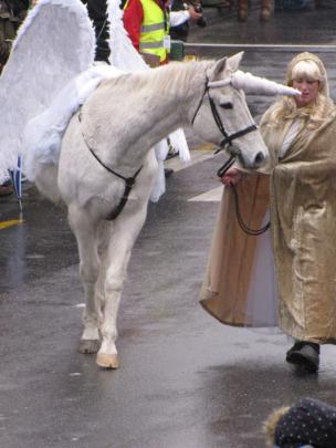 A 'unicorn' is led by Zoe Clear, of Queenstown, during the Queenstown Winter Festival Street...