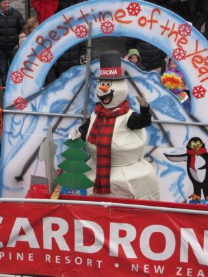 Frosty the Snowman waves to the crowd from the Cardrona float during the Queenstown Winter...
