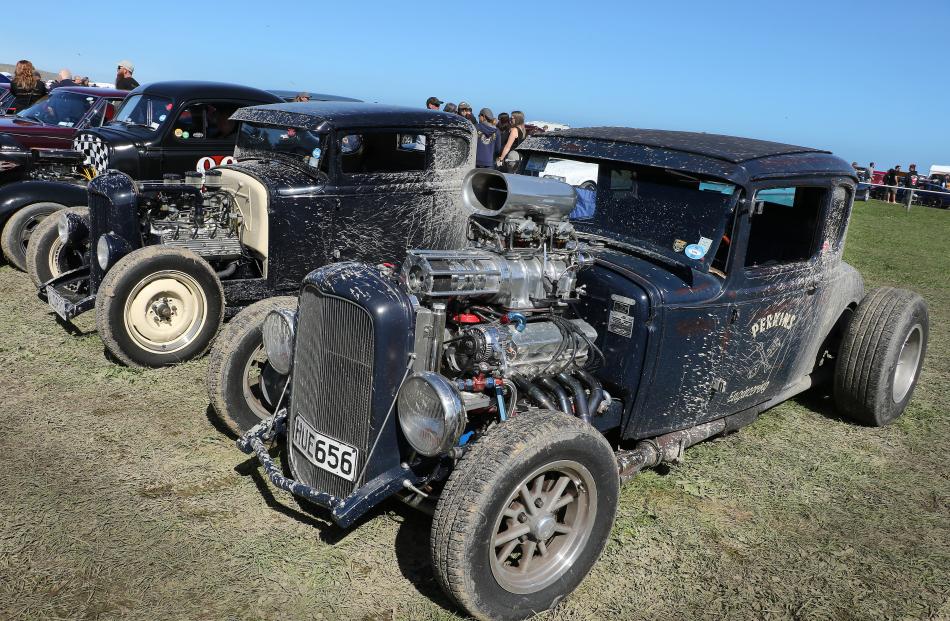 Rat rods . . . Muddy conditions underfoot didn’t seem to mind these V8 coupes on show. PHOTO:...