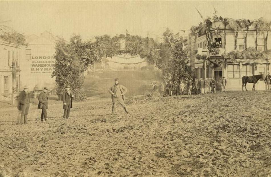 Garlands and triumphal arches were erected, as in this photo taken on the day, showing the...