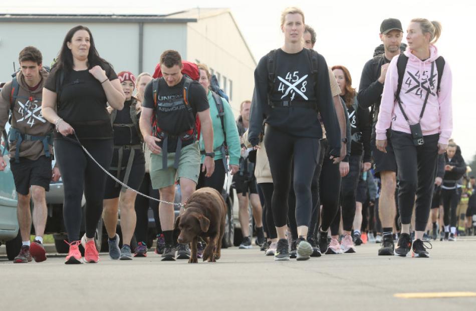 Long road ahead . . . Participants complete the first lap of many on the pack march circuit at...