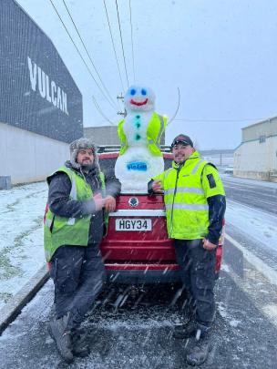 Josh Fitiao and Michael Cordtz from Vulcan Steel with snowman Kelvin. Photo: Josh Fitao