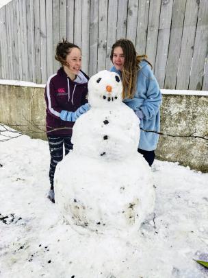 A snowman built by Hannah Reeve (left) and Brianna Paterson in Halfway Bush. Photo: Simon Paterson