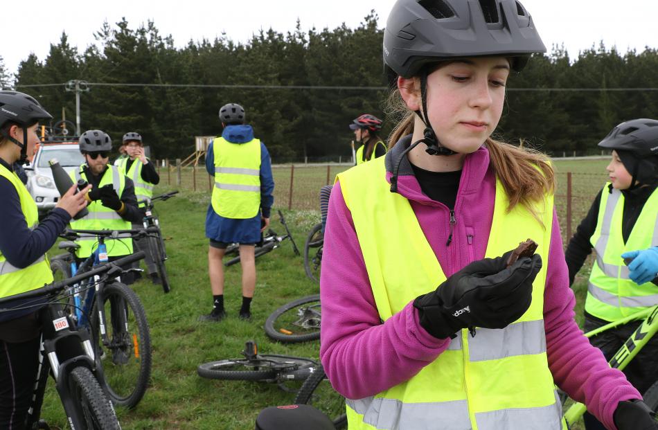 Kate Clarke  16, has a chocolate break during the cycle home to Kaiapoi. PHOTO: JOHN COSGROVE