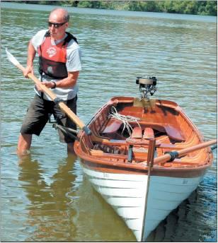 Artist Grahame Sydney gets his boat ready to defend the winning title from the 2007 dinghy day.