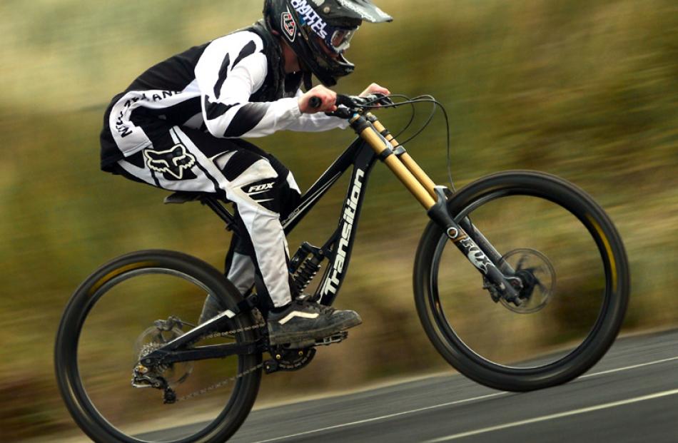 Mountain biker Josh McCombie (16) of Kings High School trains for his upcoming visit to South...