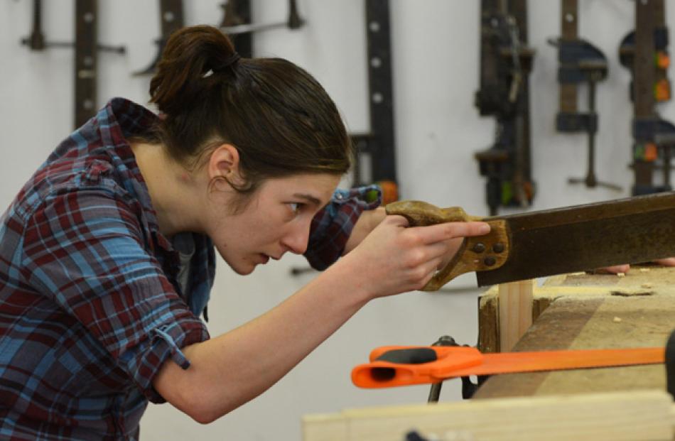 Otago Polytechnic student Hope Robertson hones her carpentery skills. Photo by Gerard O'Brien.