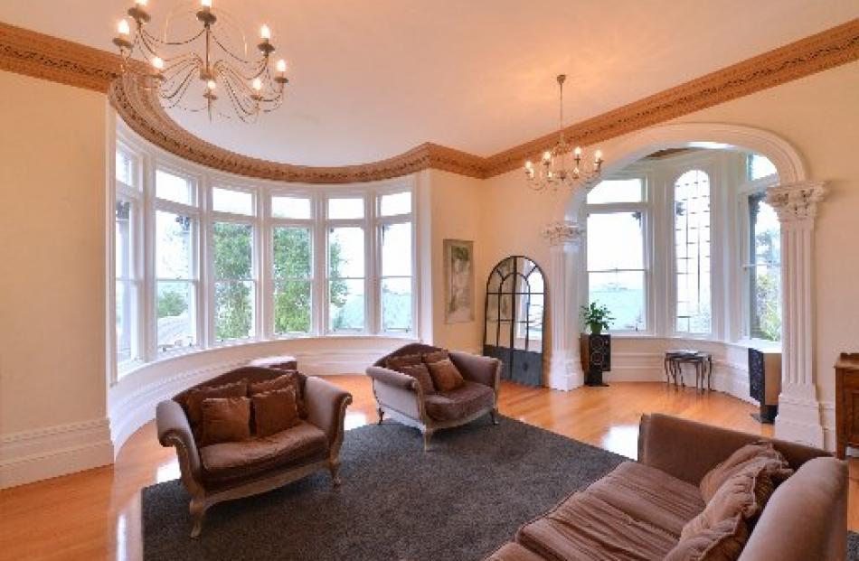 The drawing room is used for entertaining; architectural details abound.
