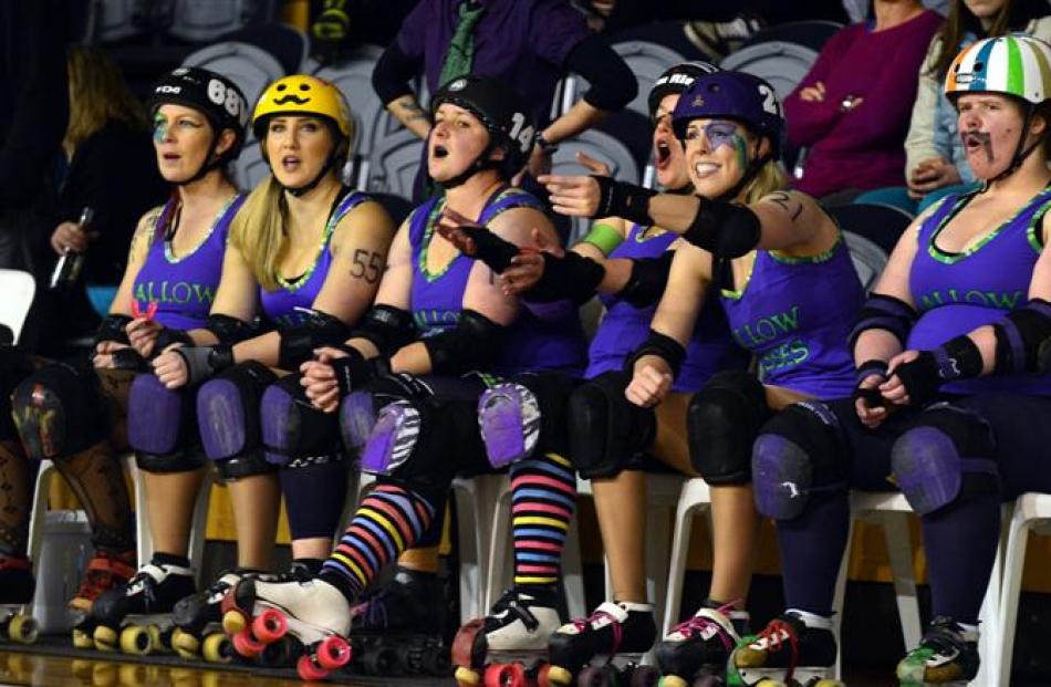 Players on the Gallow Lasses bench support their team-mates.