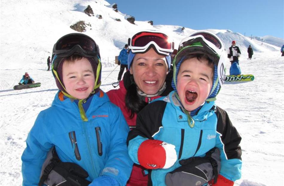 Taking a break from the slopes with their mother Lara Waenga, at Cardrona Alpine Resort on...