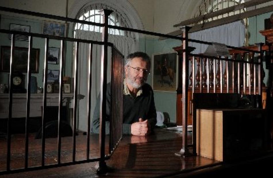 Bill Lang at the 6m-long counter made from rimu, kauri and totara and the grille which was...