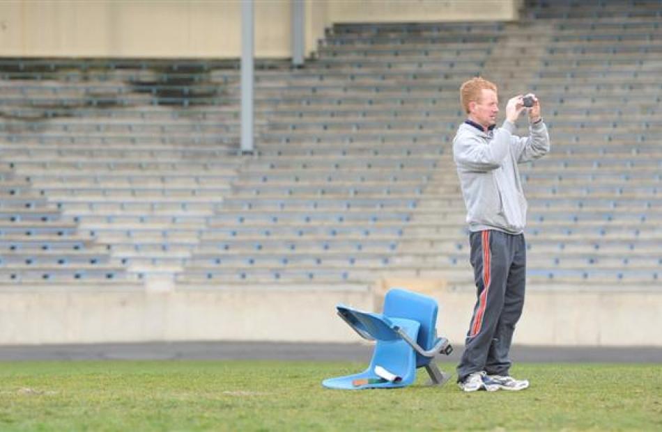 Stewart Paul, of Waikouaiti, takes a photo of the terraces