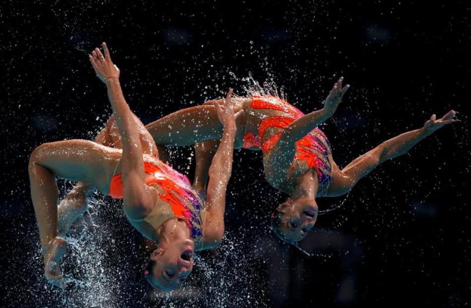 Italy's team perform in the synchronised swimming team technical final. REUTERS/Albert Gea