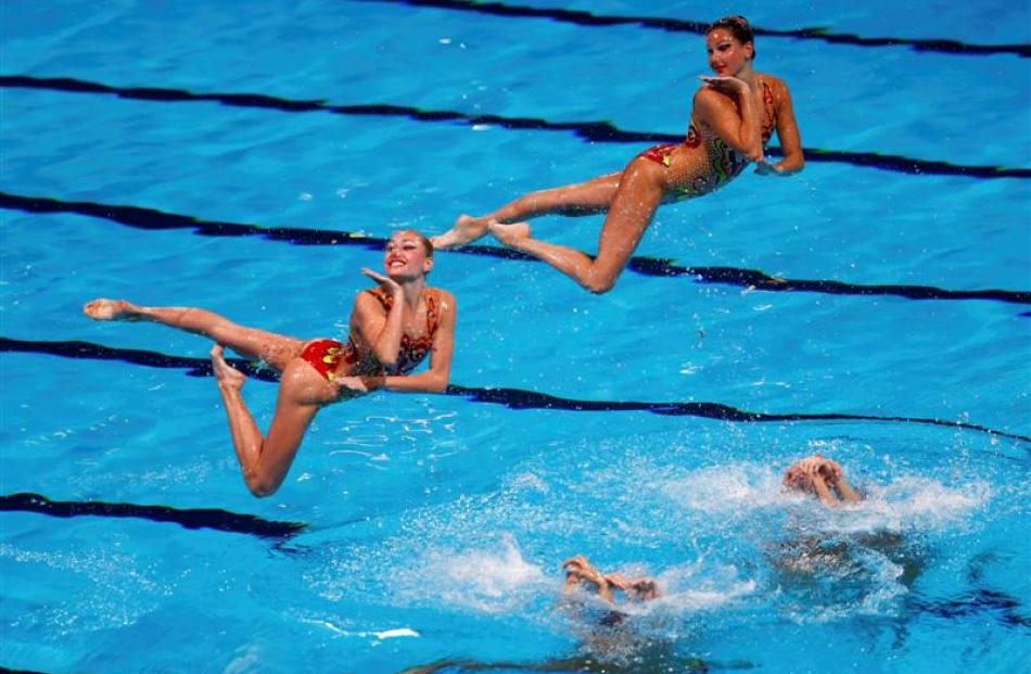 Ukraine's team perform in the synchronised swimming team technical final.REUTERS/Michael Dalder