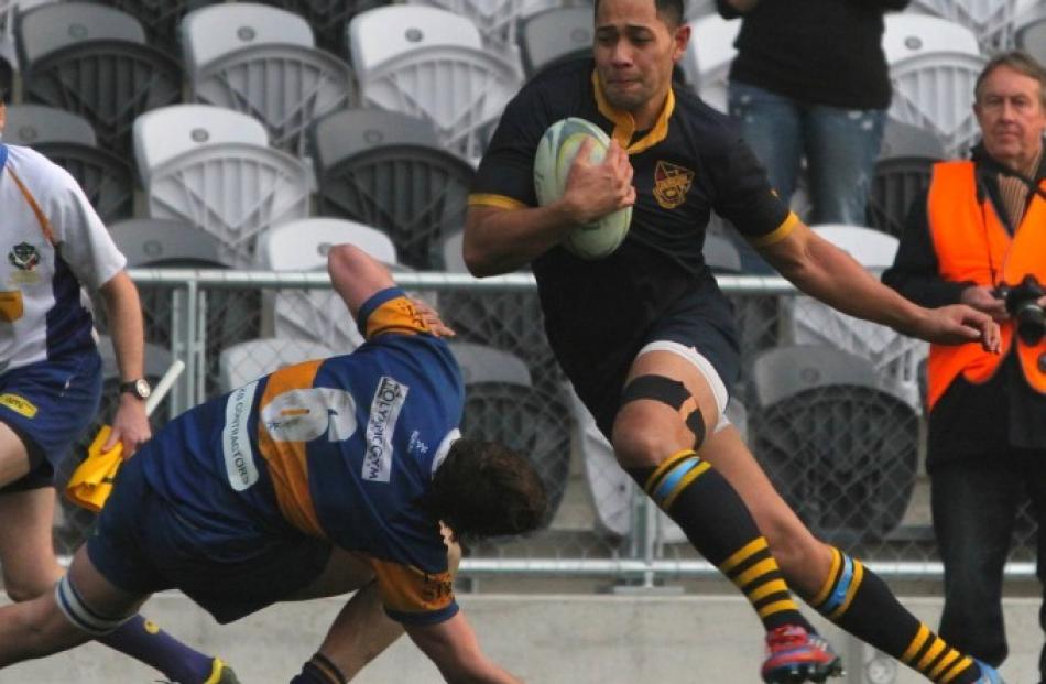 Replacement winger Sione Pulu steps inside the Taieri flanker on his way to scoring the match...