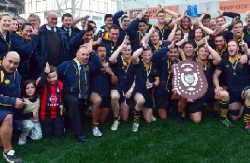The Dunedin team celebrates with the trophy after winning the  Dunedin premier championship at...